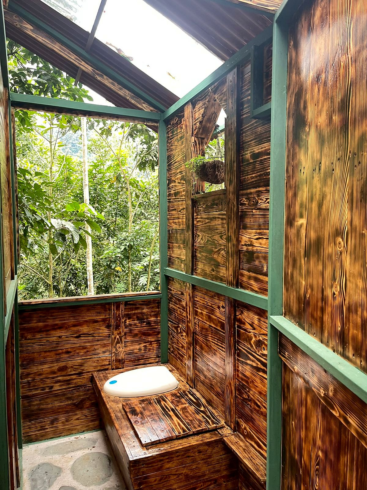 Open-air bathroom with wooden walls