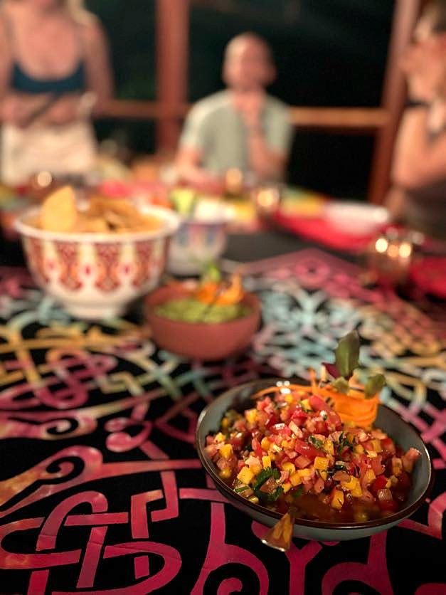 Pico de gallo and snacks on the table