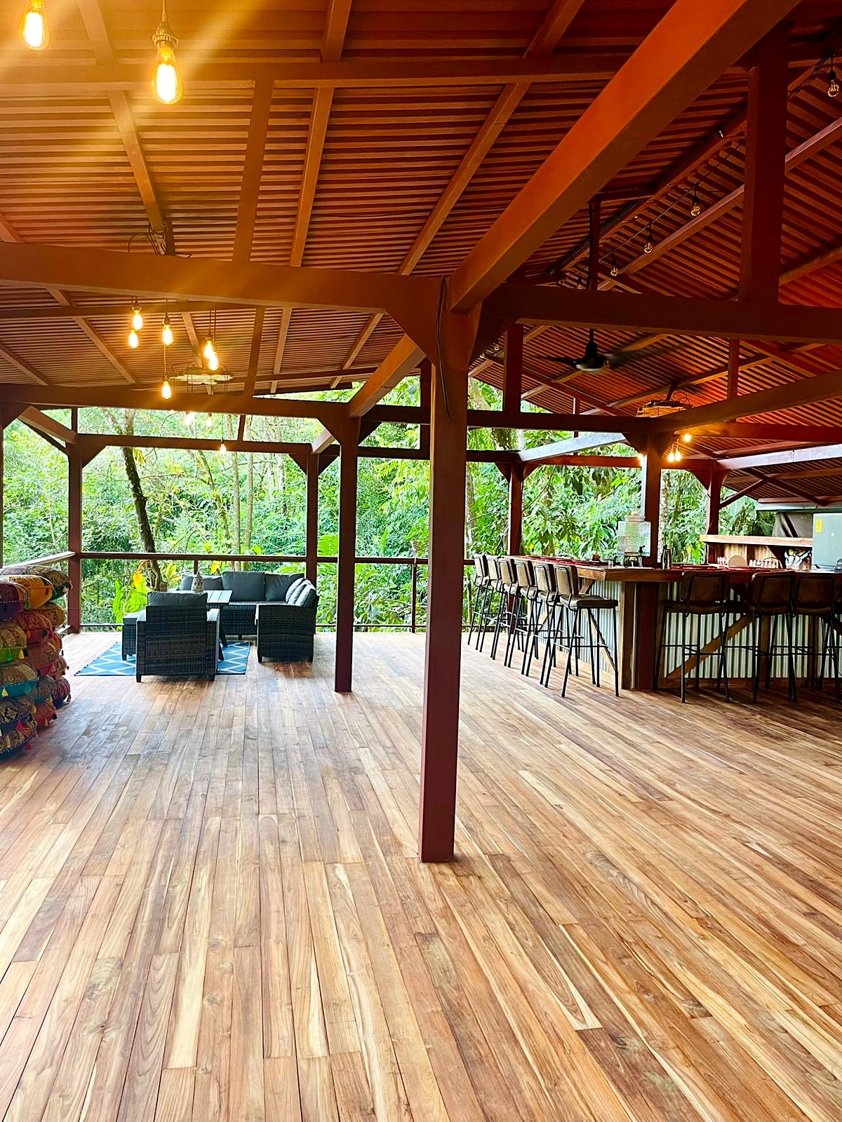The open lounge and bar under a wooden roof