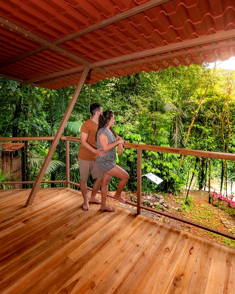 A couple on the rancho deck looking at the forest