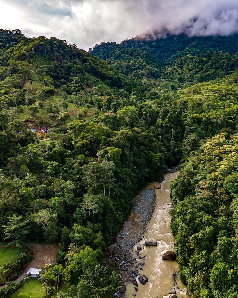 Aerial view of the river valley and the forested mountains