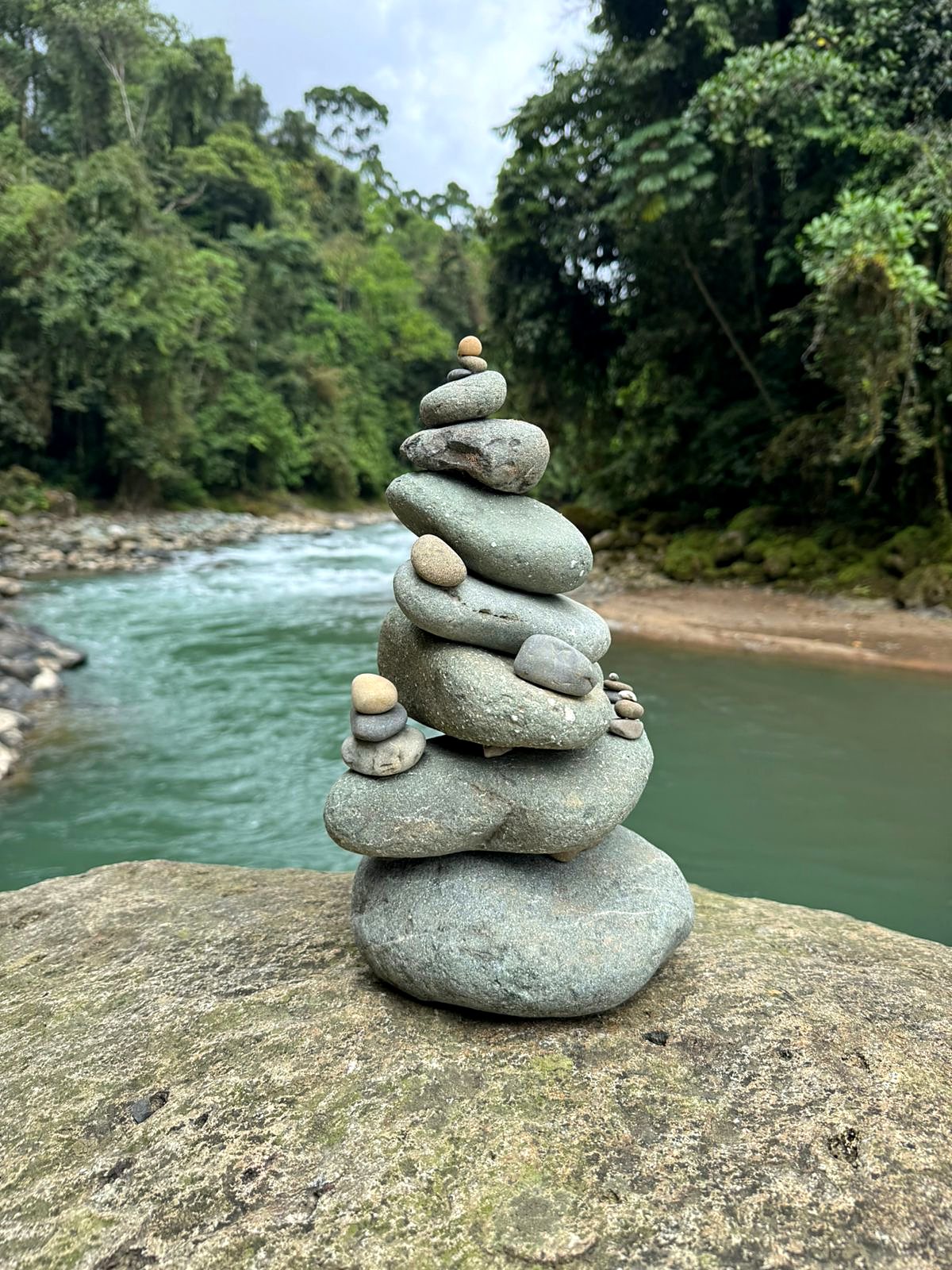 Stacked stones on a rock by the river