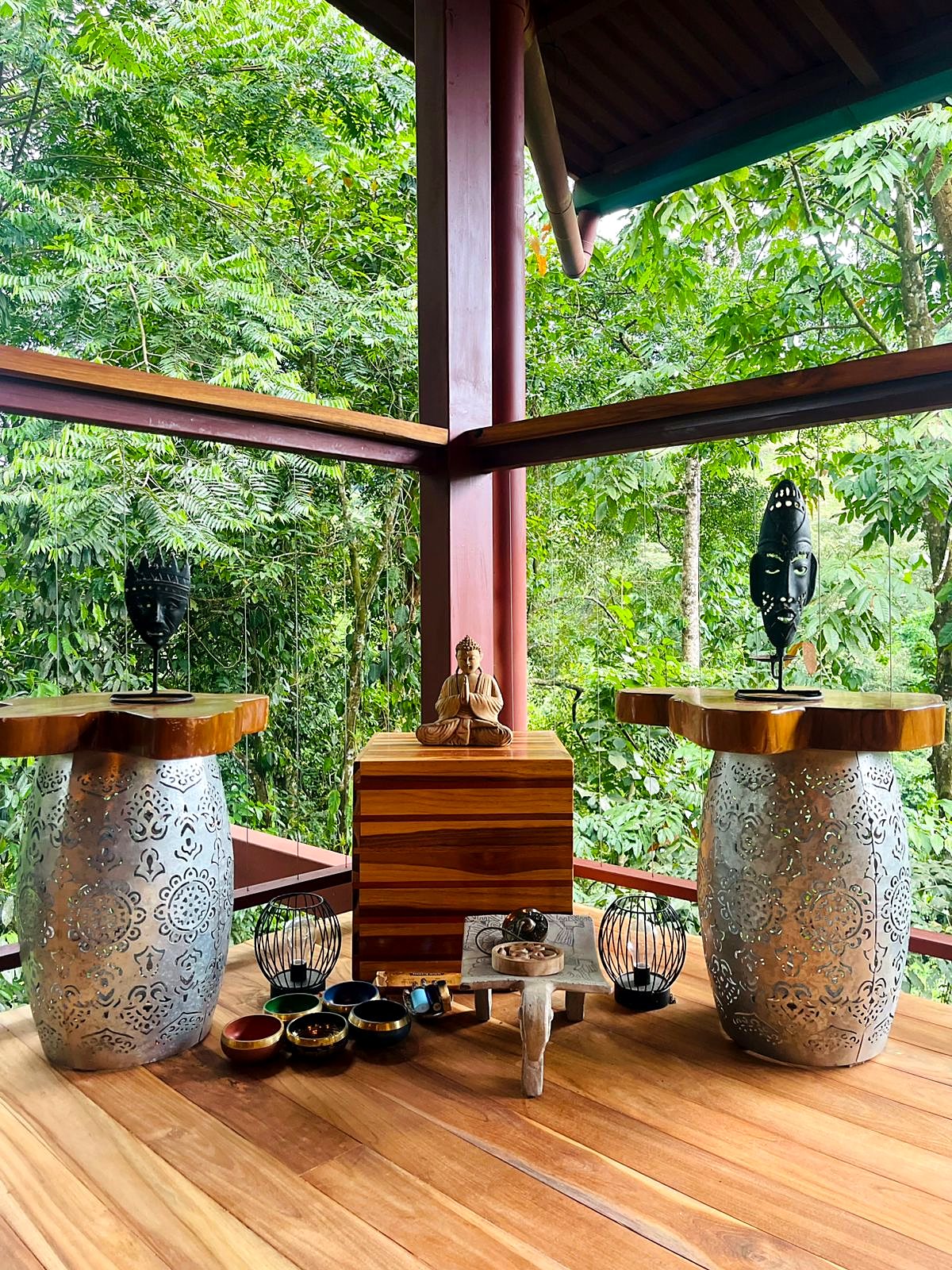 A small altar with candles on the wooden deck